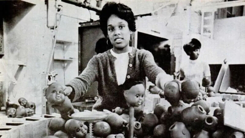 A woman manufacturing Shindana Toy dolls from a Jet Magazine story published by Johnson Publishing Company  | Still from "Lost LA" Shindana Toys