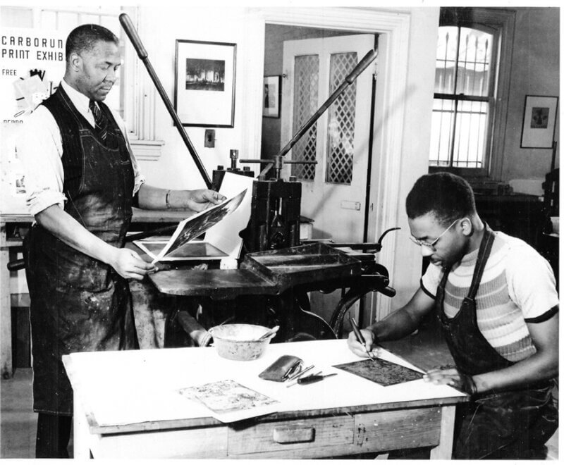 Claude Clark and Dox Thash in printmaking studio