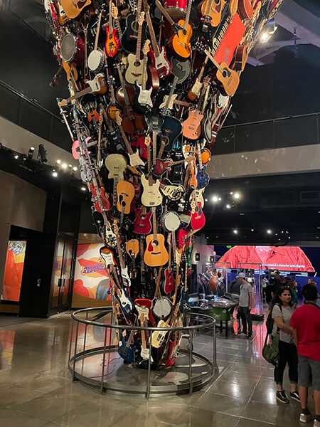 Museum of Pop Culture: A Journey Through Entertainment 7 Skychurch. A tornado -shaped exhibit of guitars on display at the museum of pop culture.