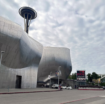 Museum of Pop Culture: A Journey Through Entertainment 2 Outside the Museum of Pop Culture with a view of the Space Needle. Seattle, Washington.